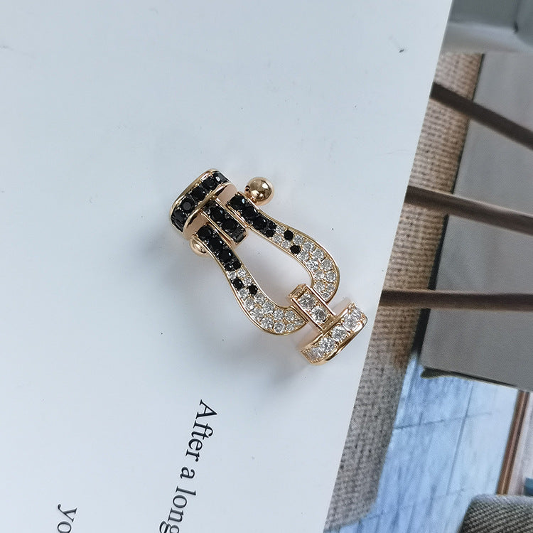 ??MIRA?¡¥FORCE LARGE HORSESHOE BLACK WHITE DIAMOND BRACELET ROSE GOLD
